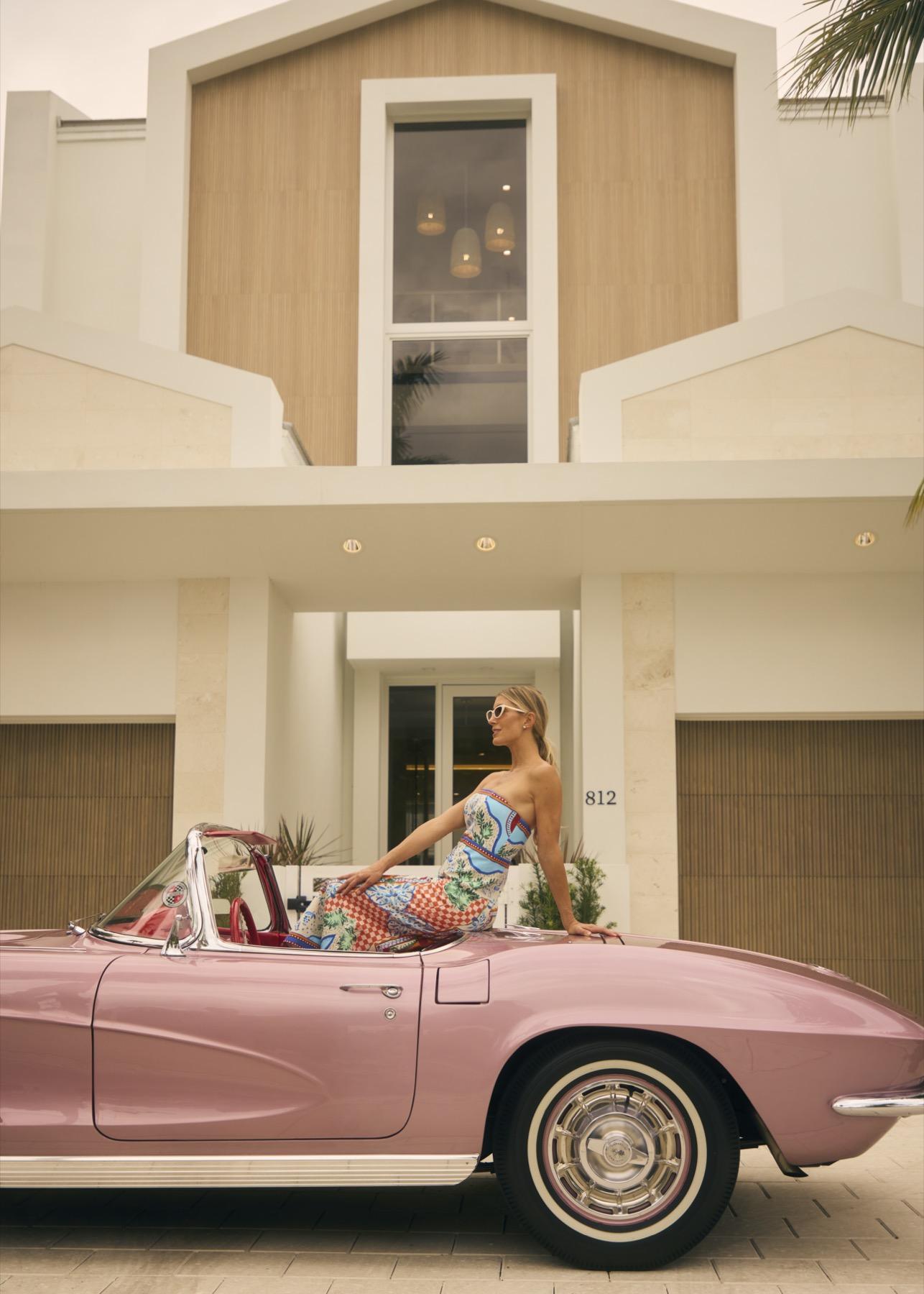 Model with a pink Corvette, Miami